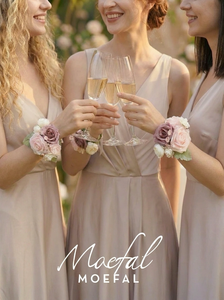 Three smiling bridesmaids toasting with champagne wearing a floral bridesmaid wrist corsage.