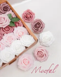 Dusty rose foam roses arranged in a gradient inside and outside a cardboard box.
