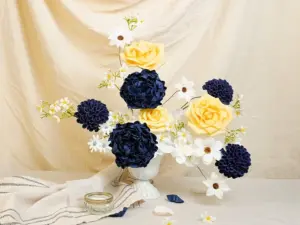 A navy and yellow bridal bouquet repurposed as an elegant home decor centerpiece.