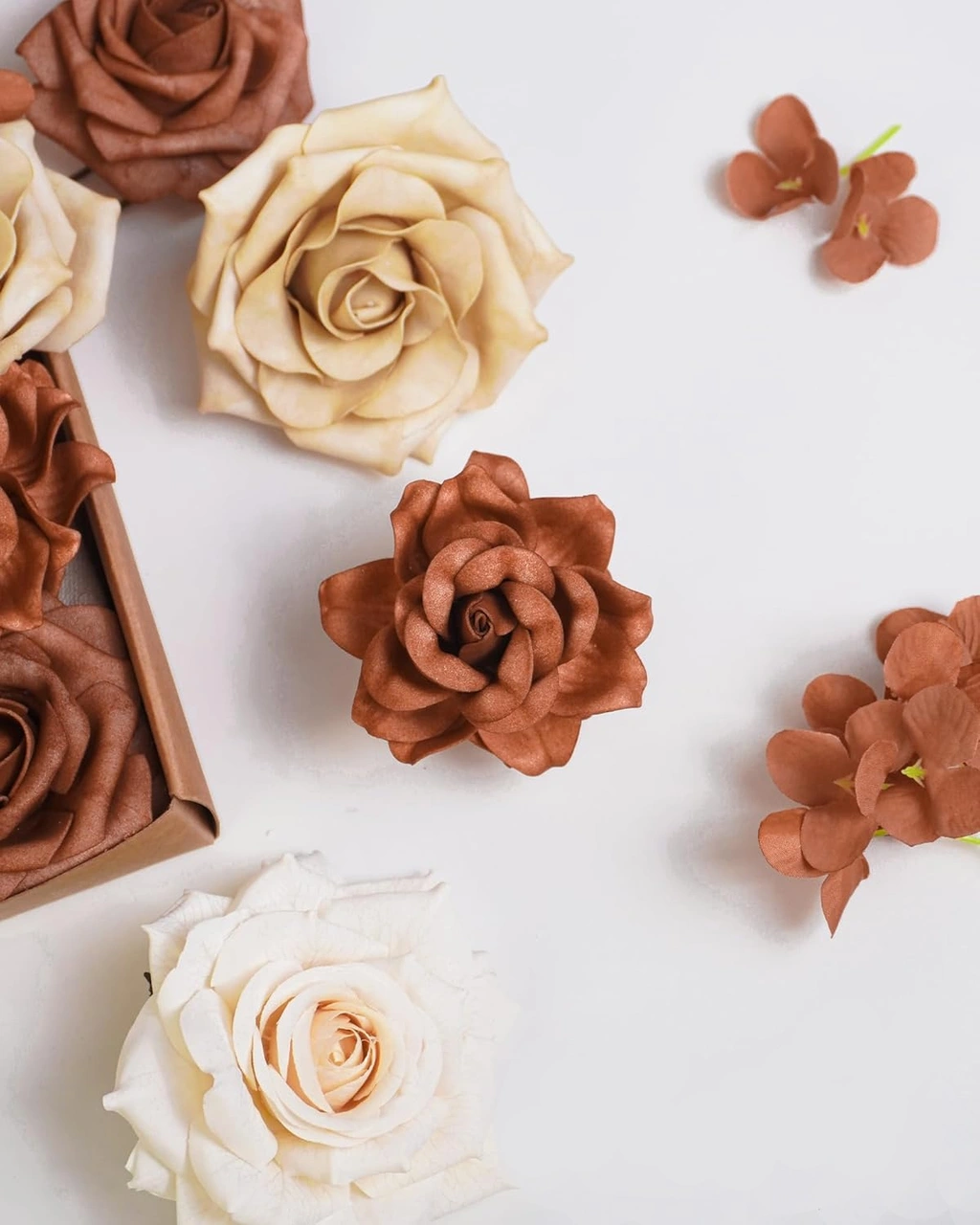 A DIY flower box kit with terracotta, champagne, and ivory roses.